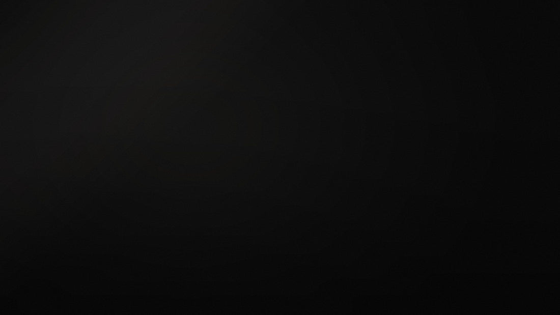Sourced brand hero backdrop in deep black with soft directional light
